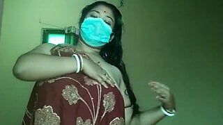 An Indian woman in a saree showing off her boobs and pussy and doing sexy moves